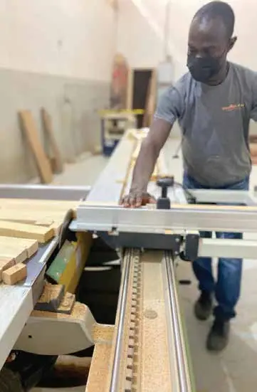 Cutting in the Nova Doors factory, Accra